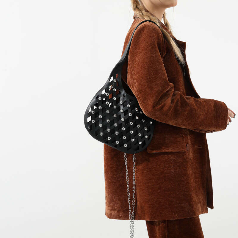 Small niche design for women hollowed out starry sky commuting armpit bag, fashionable rivet single shoulder crossbody bag 2024 new style, chic and el