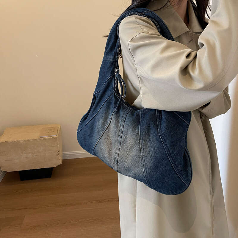 Korean version popular fashion denim shoulder for women, spicy girl, niche casual commuting armpit bag wholesale, 2024 temperament versatile new trend