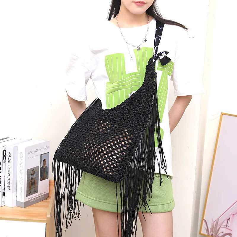 Handmade Woven Shoulder Bag with Hollowed-out Design and Tassel Pendant