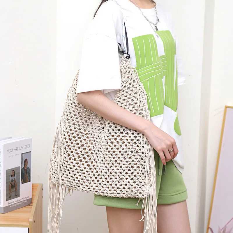 Handmade Woven Shoulder Bag with Hollowed-out Design and Tassel Pendant