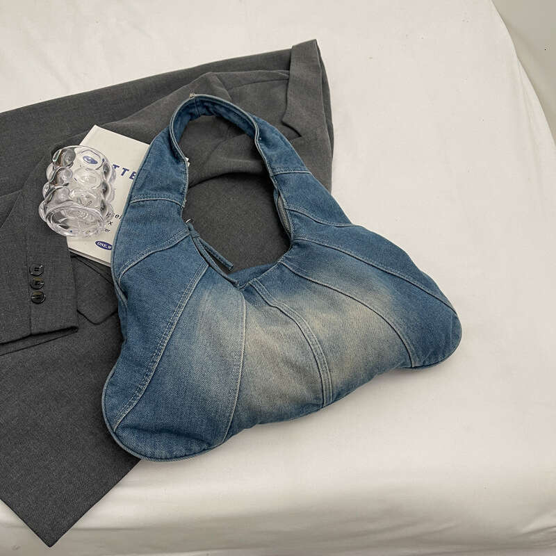 Korean version popular fashion denim shoulder for women, spicy girl, niche casual commuting armpit bag wholesale, 2024 temperament versatile new trend
