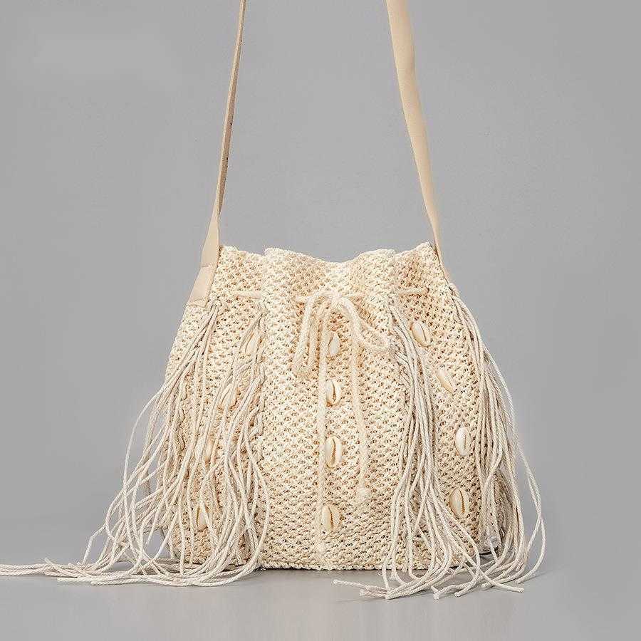 Handwoven tassel grass woven bag for women summer beach drawstring handbag with large capacity shell single shoulder diagonal cross bag 250215
