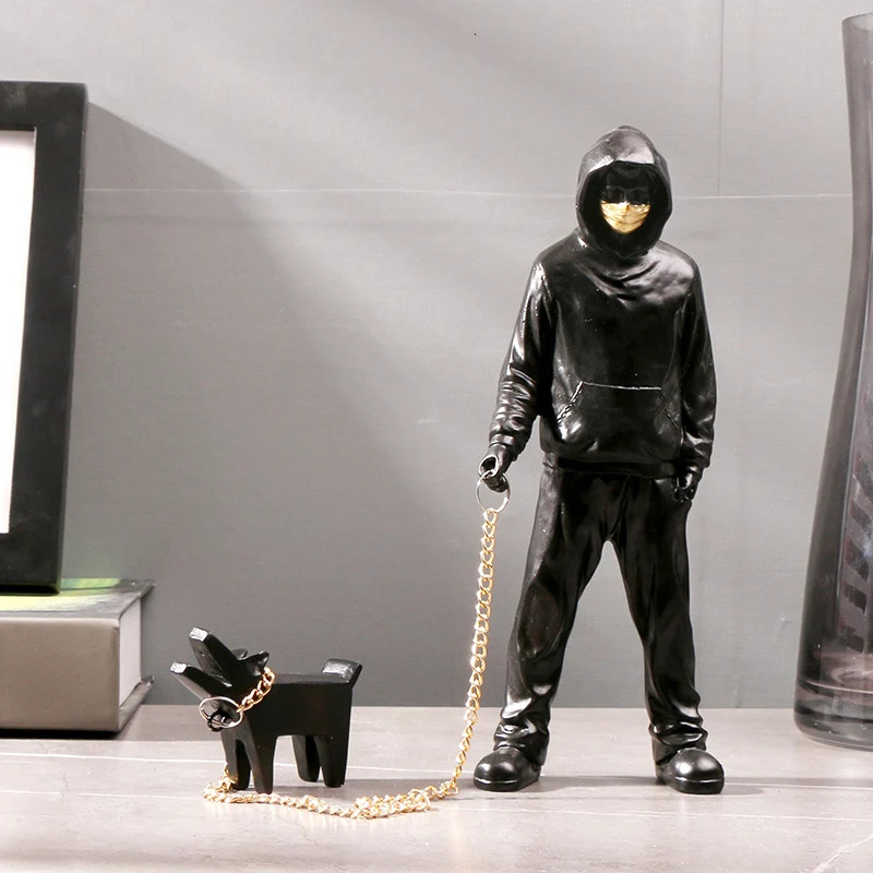 Banksy a trendy man playing with dogs white fashion toys art sculptures and ornaments 250226