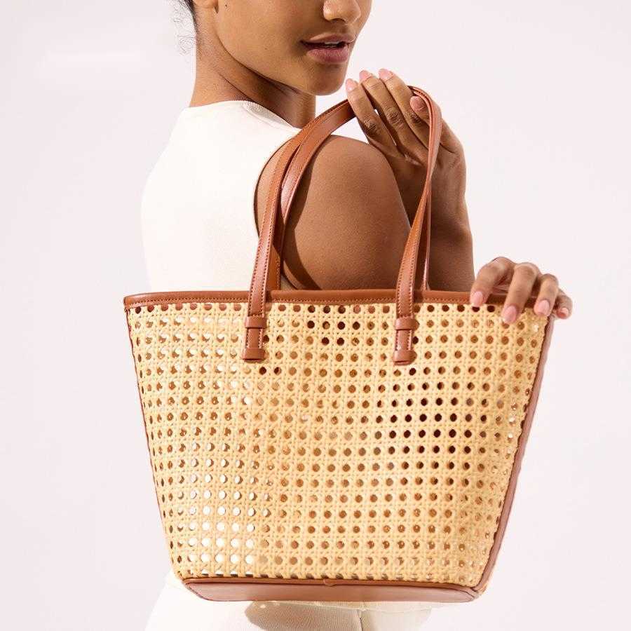 Spring summer hollowed out handmade straw woven bucket bag, large capacity rattan woven single shoulder handbag, women's beach bag 250215
