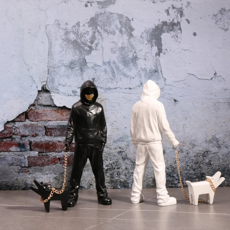 Banksy a trendy man playing with dogs white fashion toys art sculptures and ornaments 250226