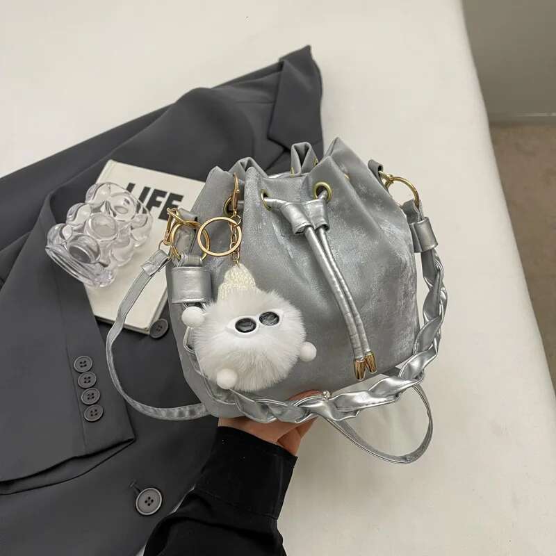 Fashion Ladies Niche Handbag Bucket Girls Hundred Chain Shoulder Crossbody Bag With Hanging Doll Decoration PU Material