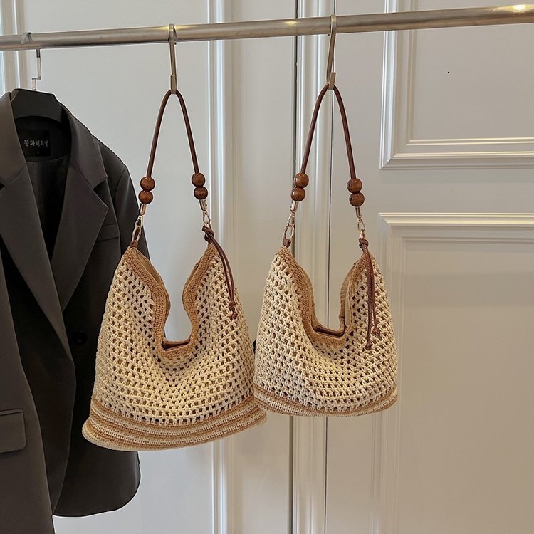 Spring and summer hollow women's 2025 new commuting single shoulder diagonal cross beach vacation grass woven tote bag #swissmilitary