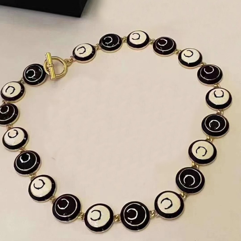 Chic Pearl and Black Enamel Chains Necklace with Gold Tone Accents Fashion Jewelry for Womens Stylish Layered Necklace with Classic Charm