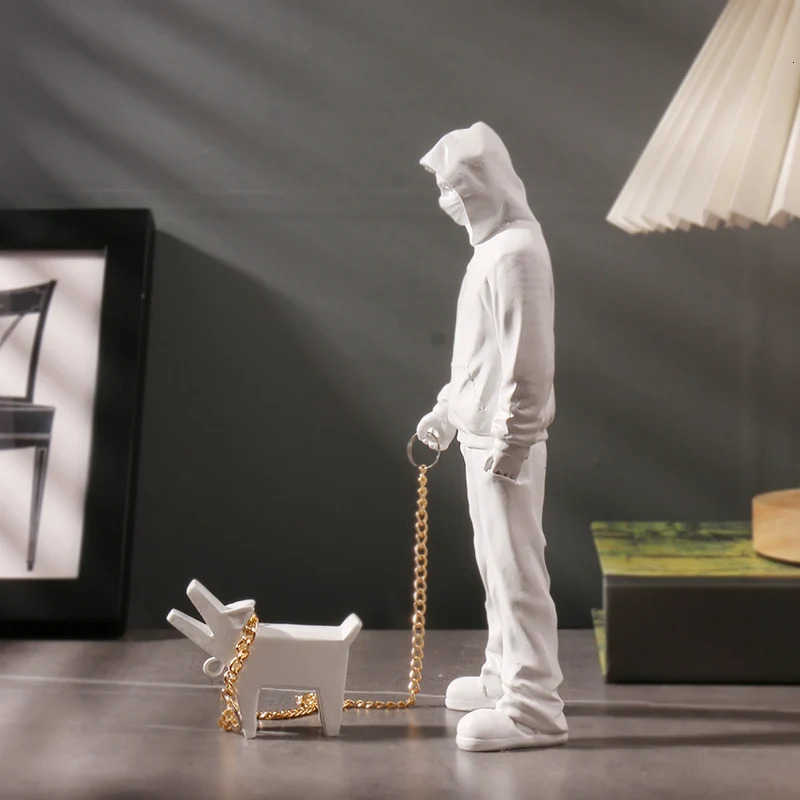 Banksy a trendy man playing with dogs white fashion toys art sculptures and ornaments 250226