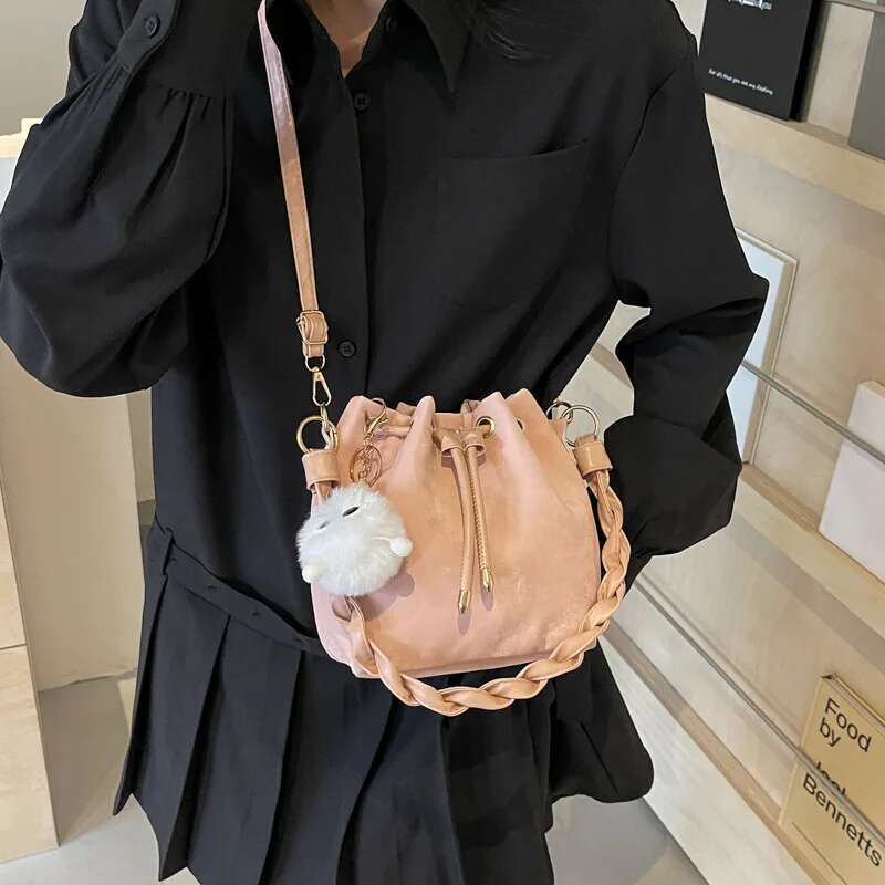 Fashion Ladies Niche Handbag Bucket Girls Hundred Chain Shoulder Crossbody Bag With Hanging Doll Decoration PU Material
