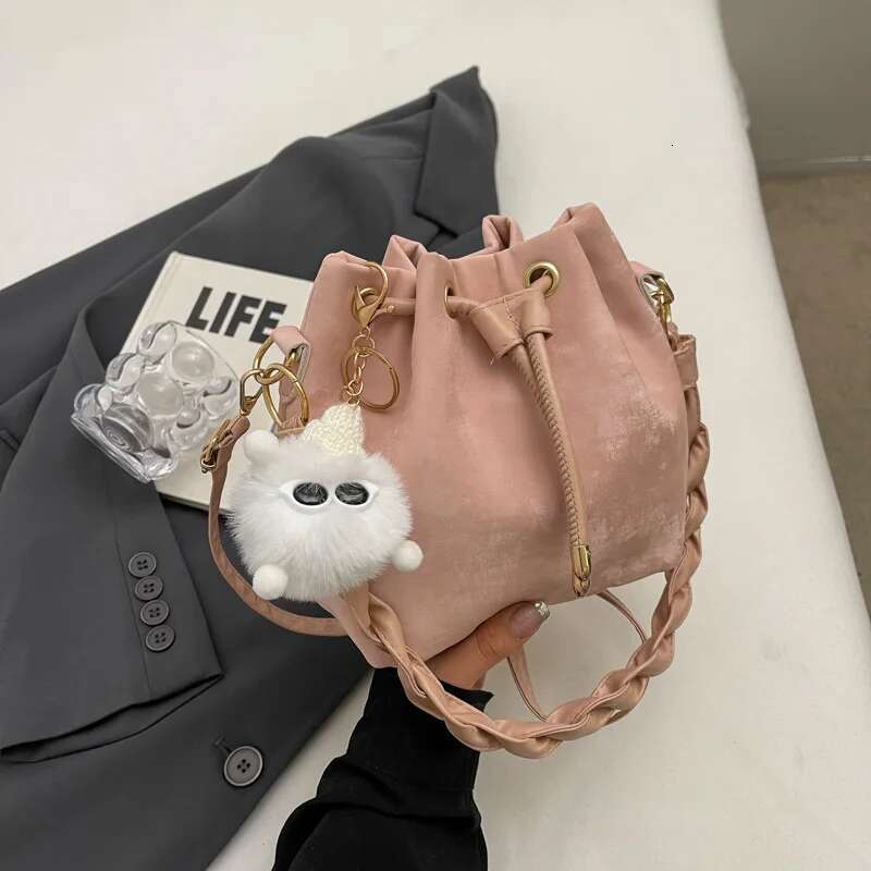 Fashion Ladies Niche Handbag Bucket Girls Hundred Chain Shoulder Crossbody Bag With Hanging Doll Decoration PU Material