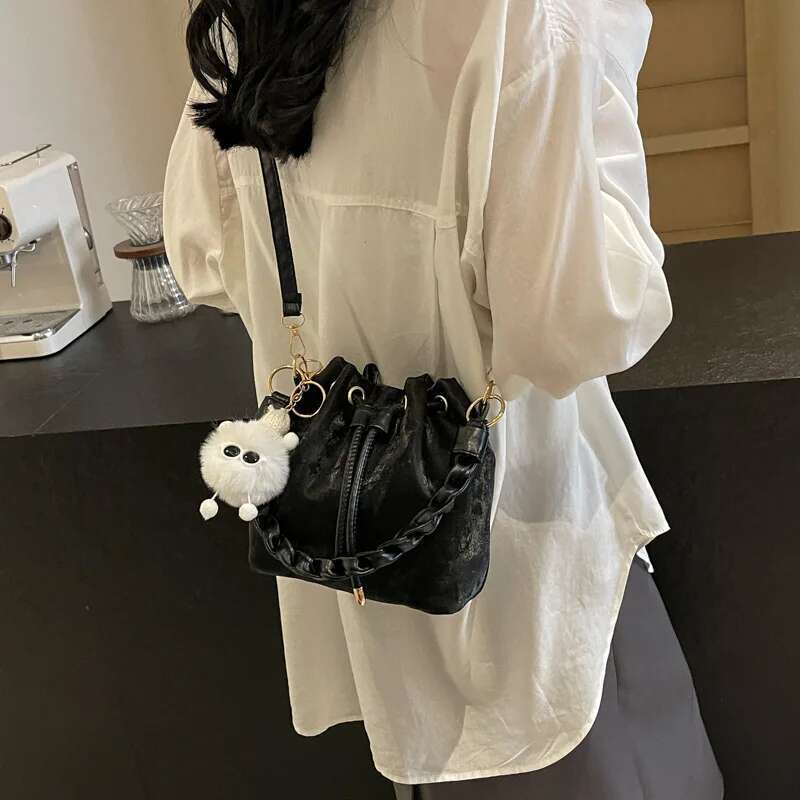 Fashion Ladies Niche Handbag Bucket Girls Hundred Chain Shoulder Crossbody Bag With Hanging Doll Decoration PU Material