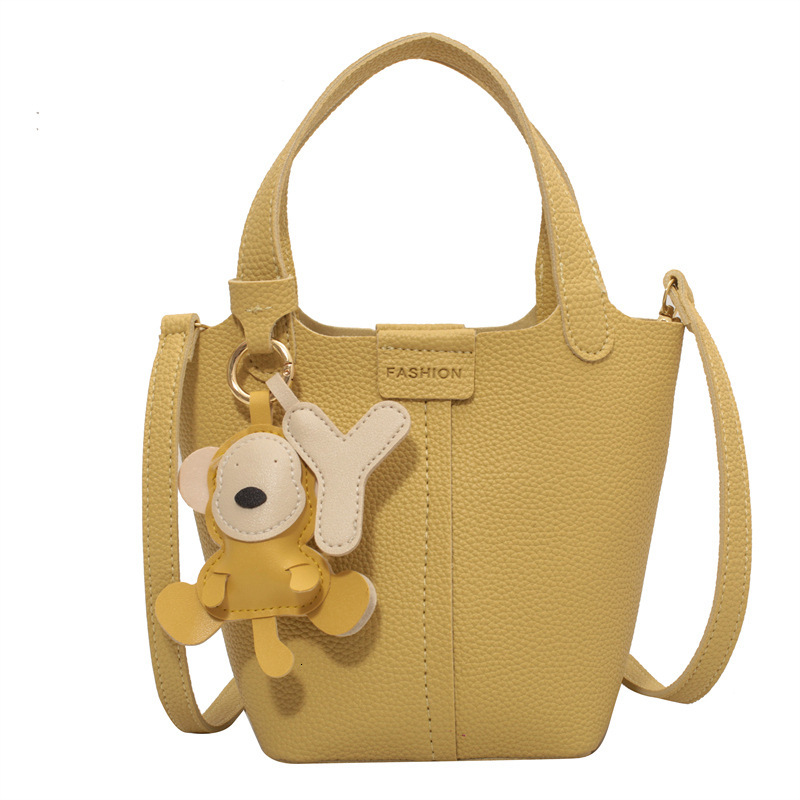 Women's bucket bag new fashionable shoulder bag with cute monkey pendant crossbody bag designer women's crossbody bag