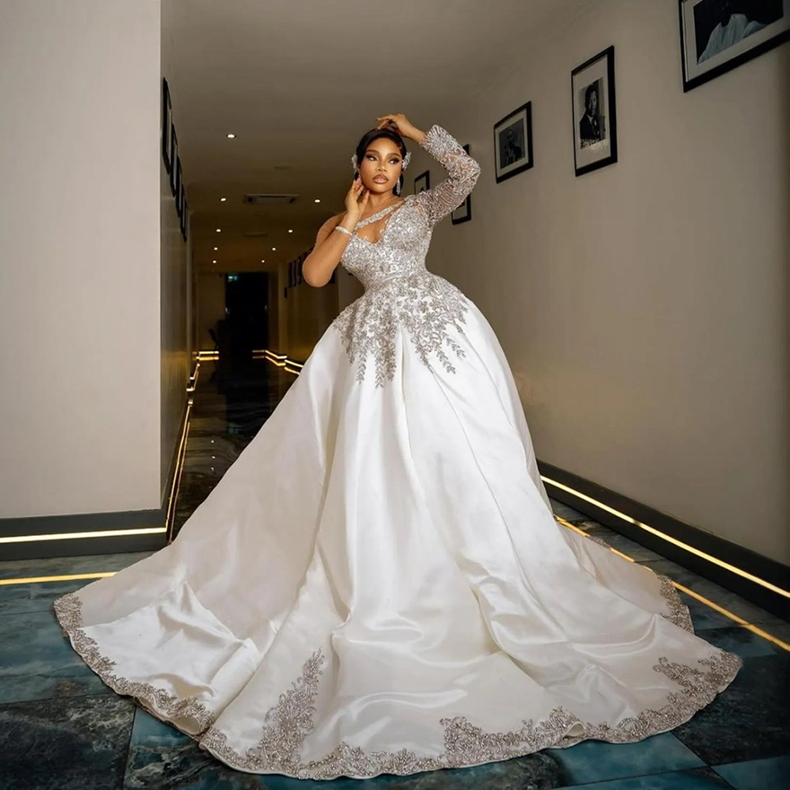 2025 African A-Line Wedding Dress Bridal Gowns for Bride Illusion Sheer Neck Long Sleeves Appliqued Beaded Rhinestones Crystals Satin Wedding Gowns Fo