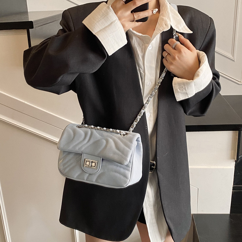 Free Shipping 2025 New High-end Versatile Underarm Bag Designer Bag Beach Bag Small Chanel Style Striped Commuter Shoulder Bag Chain Texture Crossbody