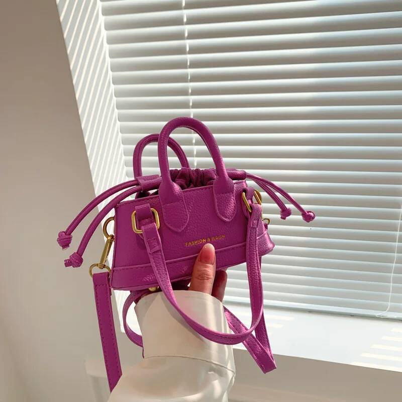 2025 new fashionable drawstring girl one-piece new splicing designer women's handbag simple mini girl shoulder bag niche design shell bag car sew