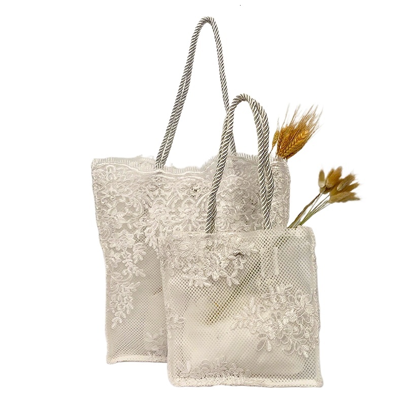 designer 2025 Embroidered Hollow Matte Silk Hot-Selling Straw Woven Handbag Travel Vacation Beach Bag Lace Bag