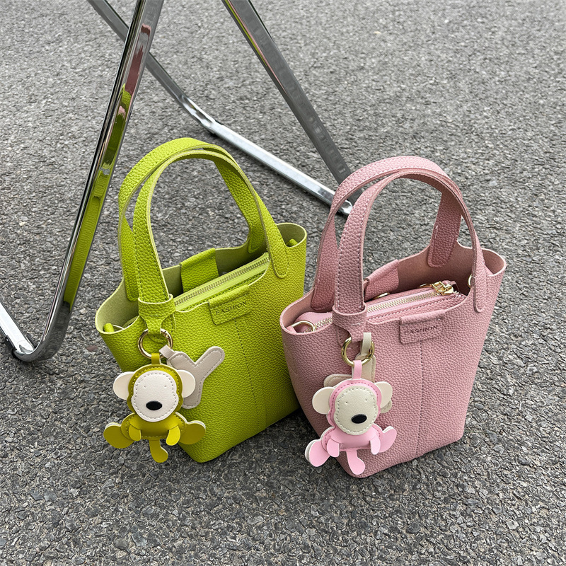 Women's bucket bag new fashionable shoulder bag with cute monkey pendant crossbody bag designer women's crossbody bag