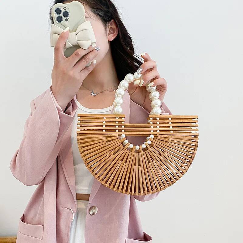 2025 new hand woven handbag, handheld beach bag, hollow semi-circular bamboo woven bag, designer fashion vacation bag 3