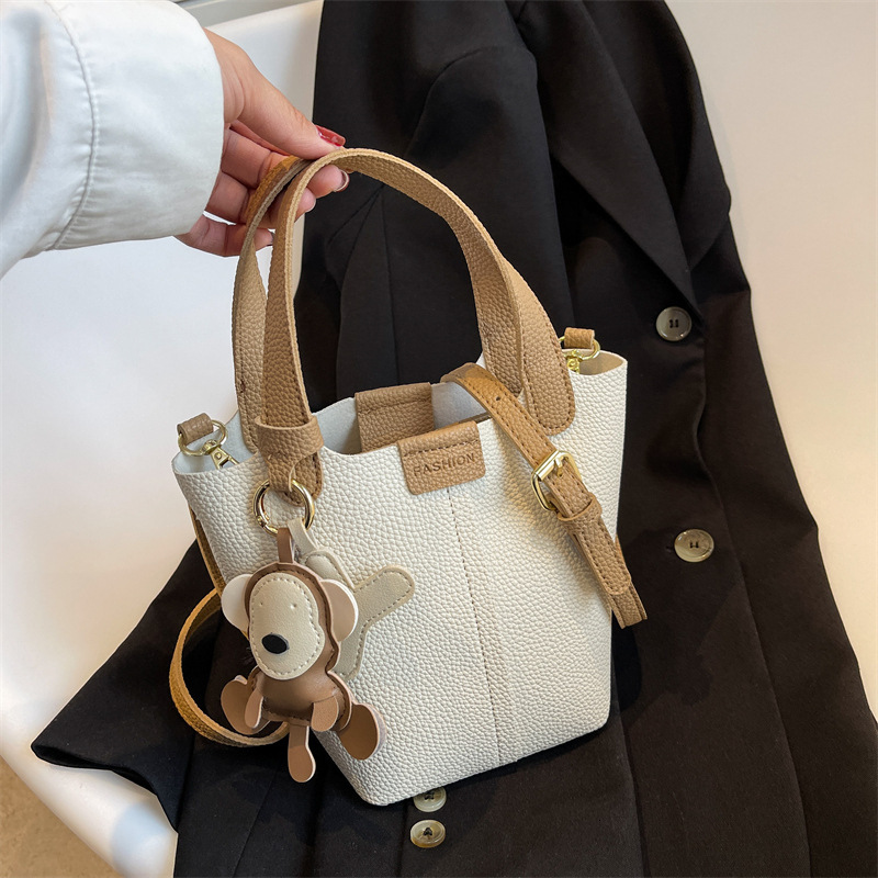 Women's bucket bag new fashionable shoulder bag with cute monkey pendant crossbody bag designer women's crossbody bag