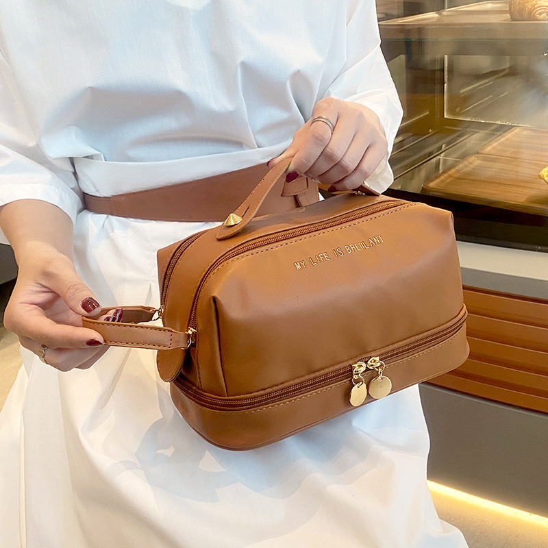 designer 2025 New PU Leather Handheld Makeup Bag Large Capacity Divider Board Skincare Storage Bag Simple Waterproof Toiletry Bag