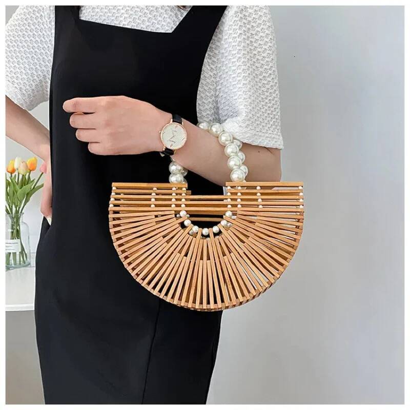 2025 new hand woven handbag, handheld beach bag, hollow semi-circular bamboo woven bag, designer fashion vacation bag 3