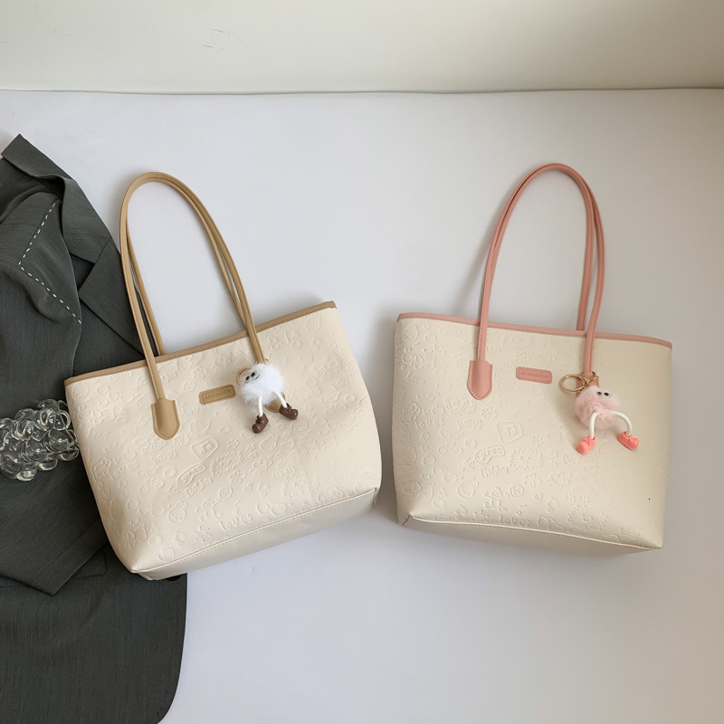 Top brand high-quality new free designer bag cute embossed large capacity handbag 2025 fashion trend multifunctional color block shoulder bag new free