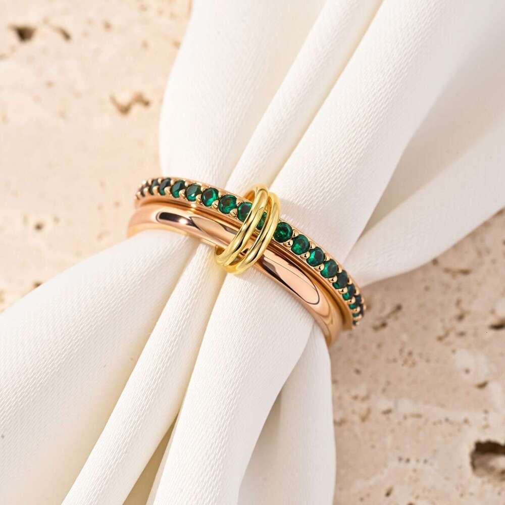 goldplated copper interlocking stacking rings inlaid with green cubic zirconia jewelry