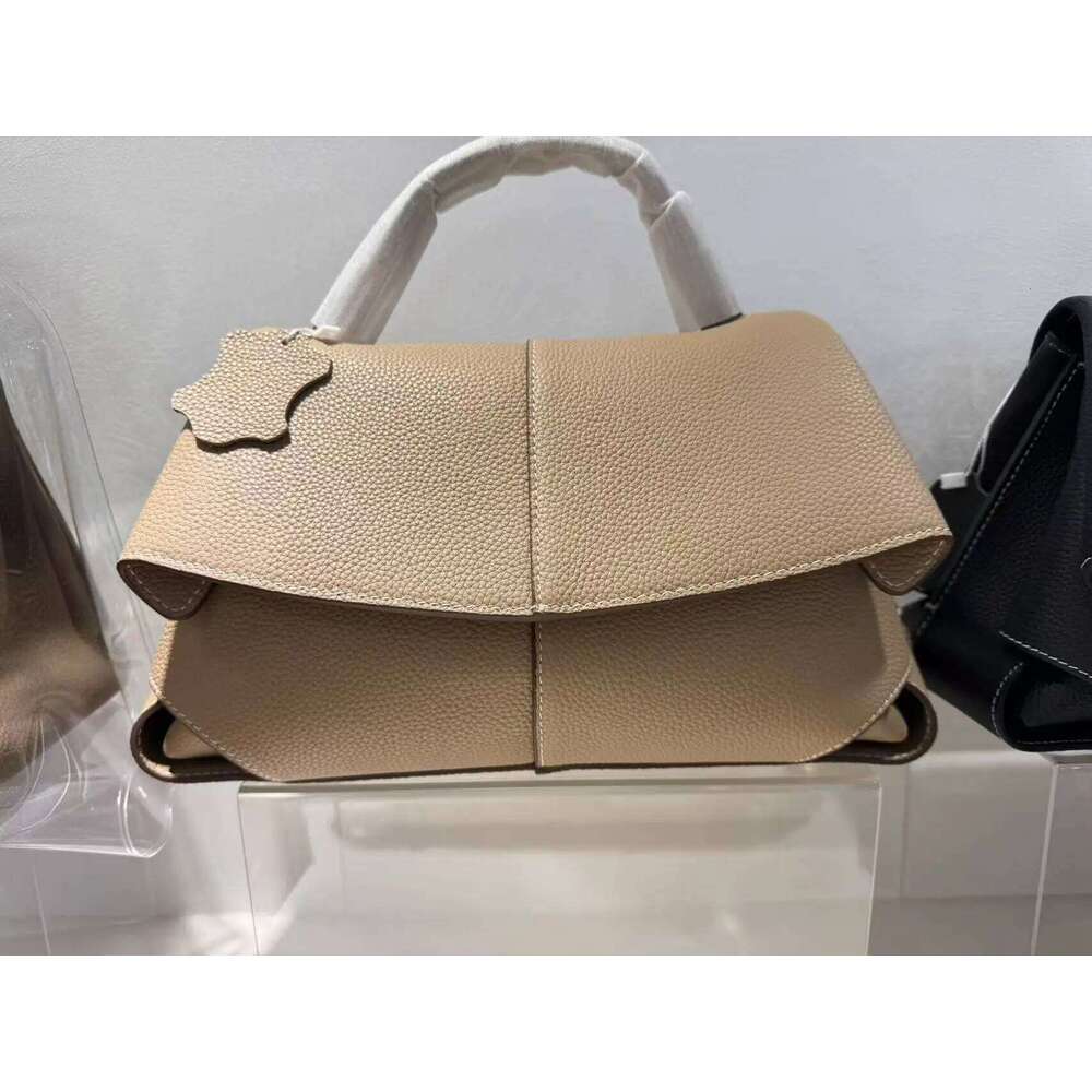 High end leather smile bag with pleated design, single shoulder large capacity commuting handbag