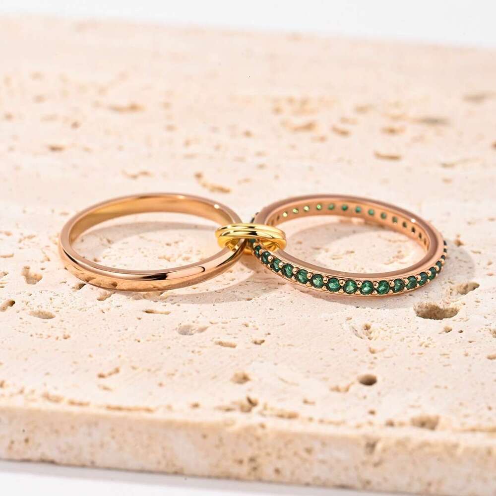 goldplated copper interlocking stacking rings inlaid with green cubic zirconia jewelry