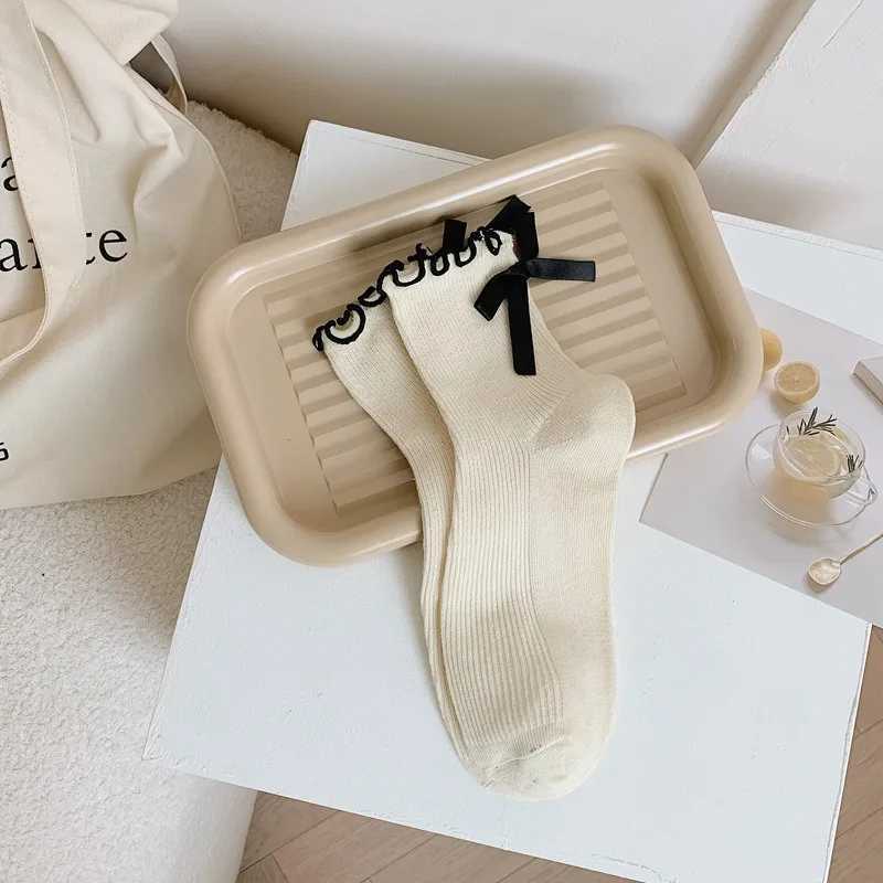 Japanese JK Sweet Bowknot Tied Middle Tube Socks Women Heel Bow Casual Black White Pile Socks Girls Sports Cotton Socks T250602