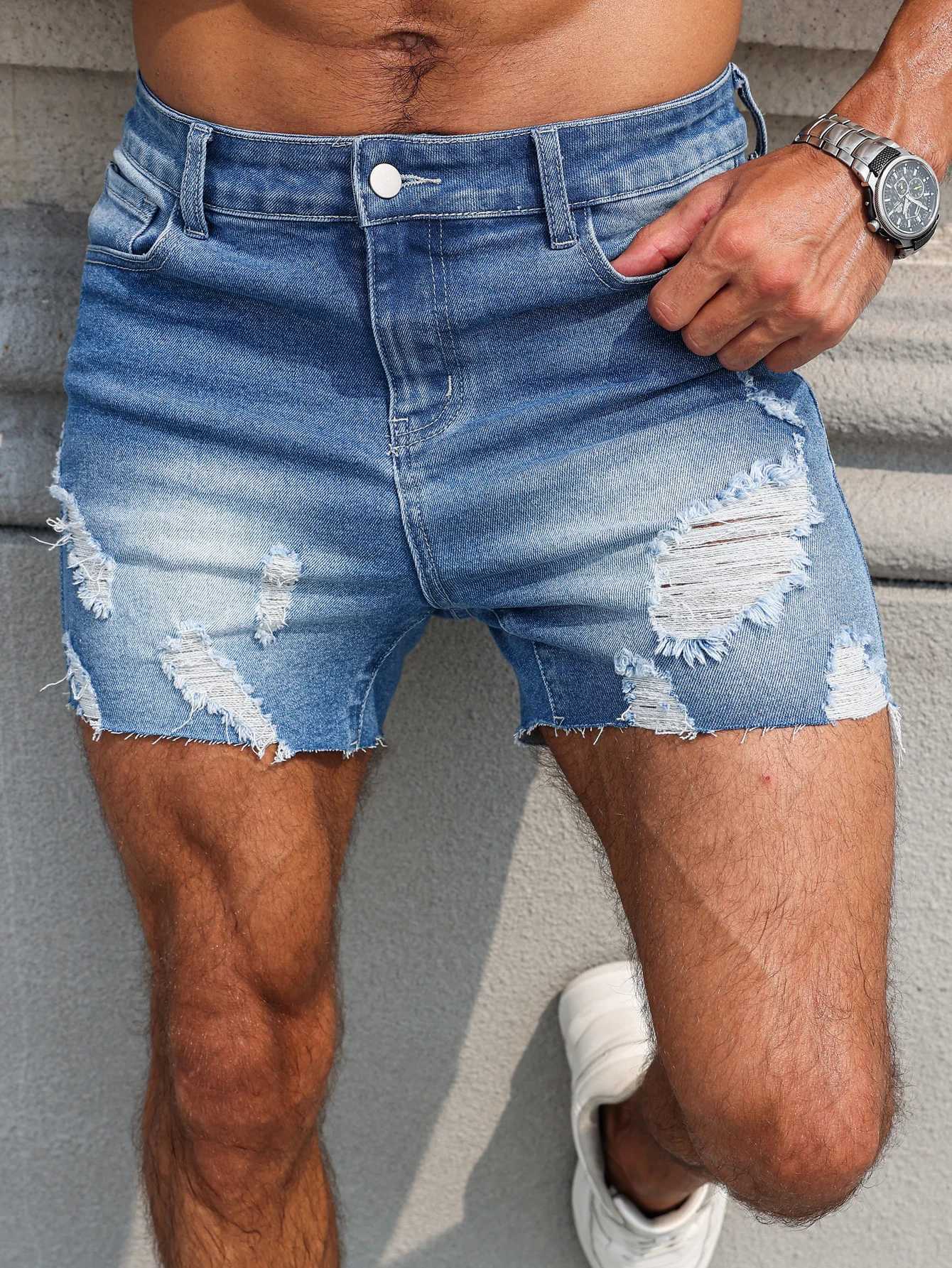Mens Blue Denim Shorts.The ripped and worn style is popular. T250603