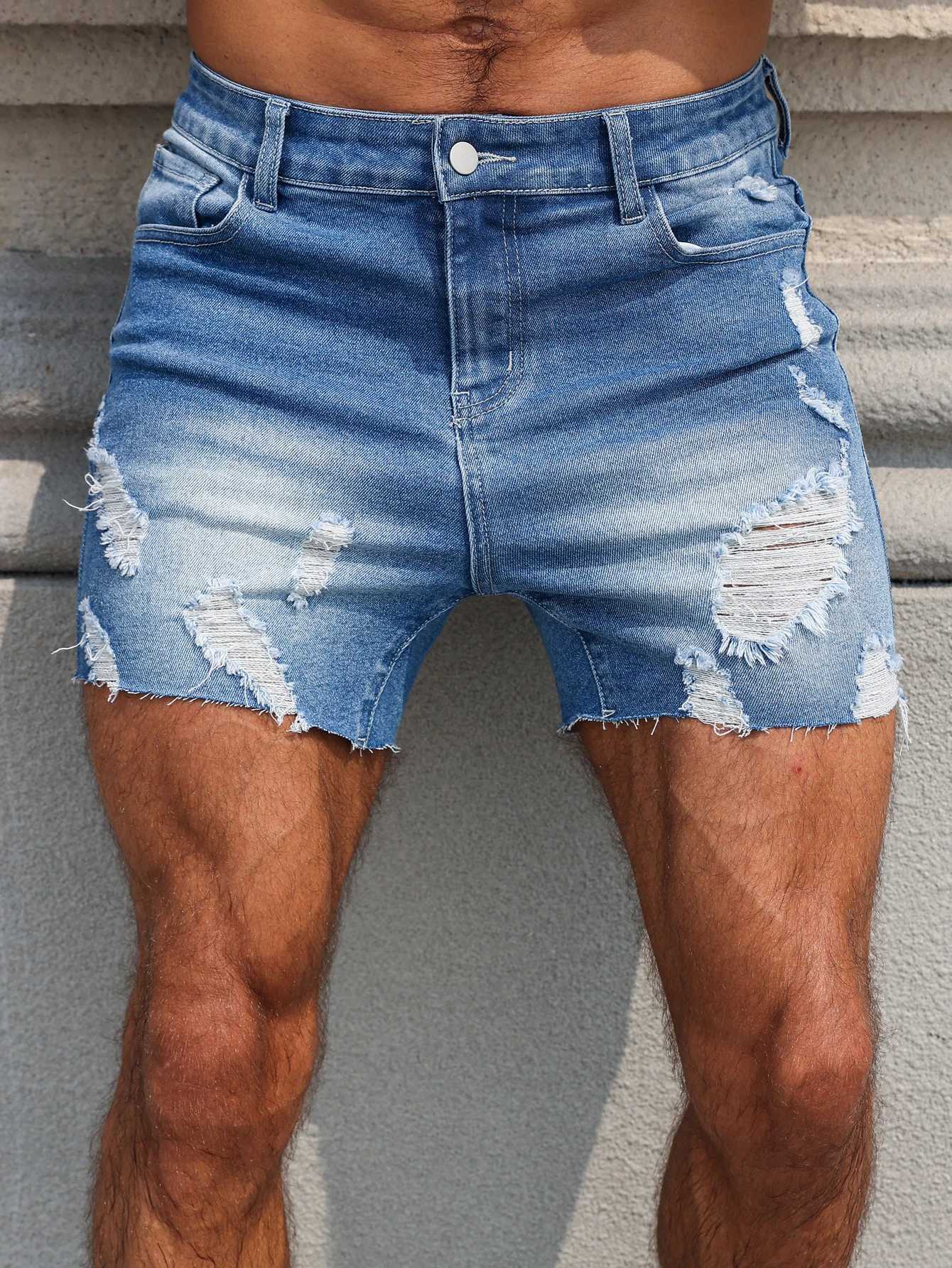 Mens Blue Denim Shorts.The ripped and worn style is popular. T250603