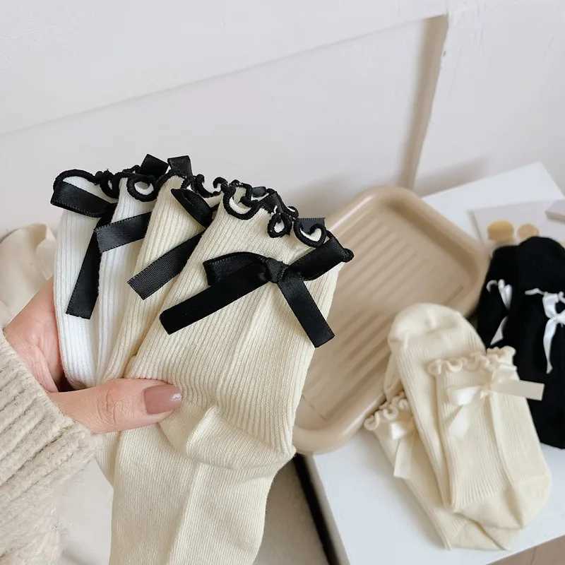 Japanese JK Sweet Bowknot Tied Middle Tube Socks Women Heel Bow Casual Black White Pile Socks Girls Sports Cotton Socks T250602