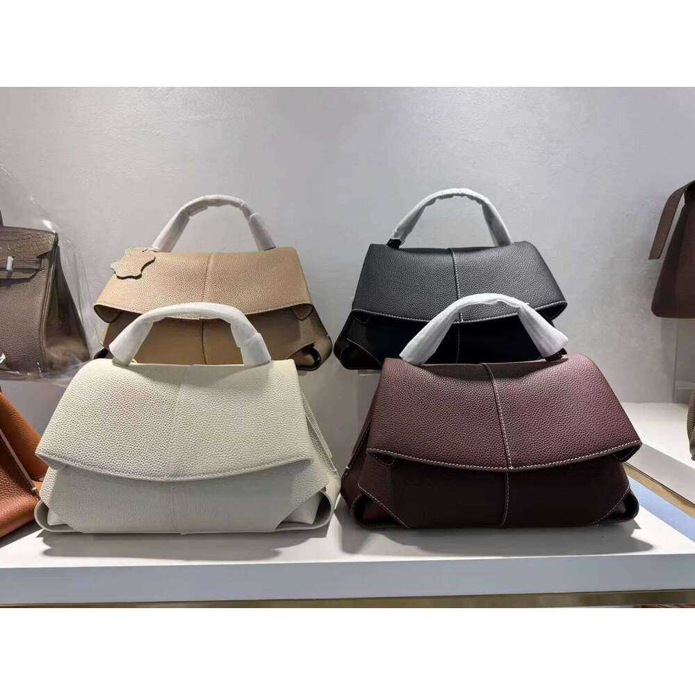 High end leather smile bag with pleated design, single shoulder large capacity commuting handbag