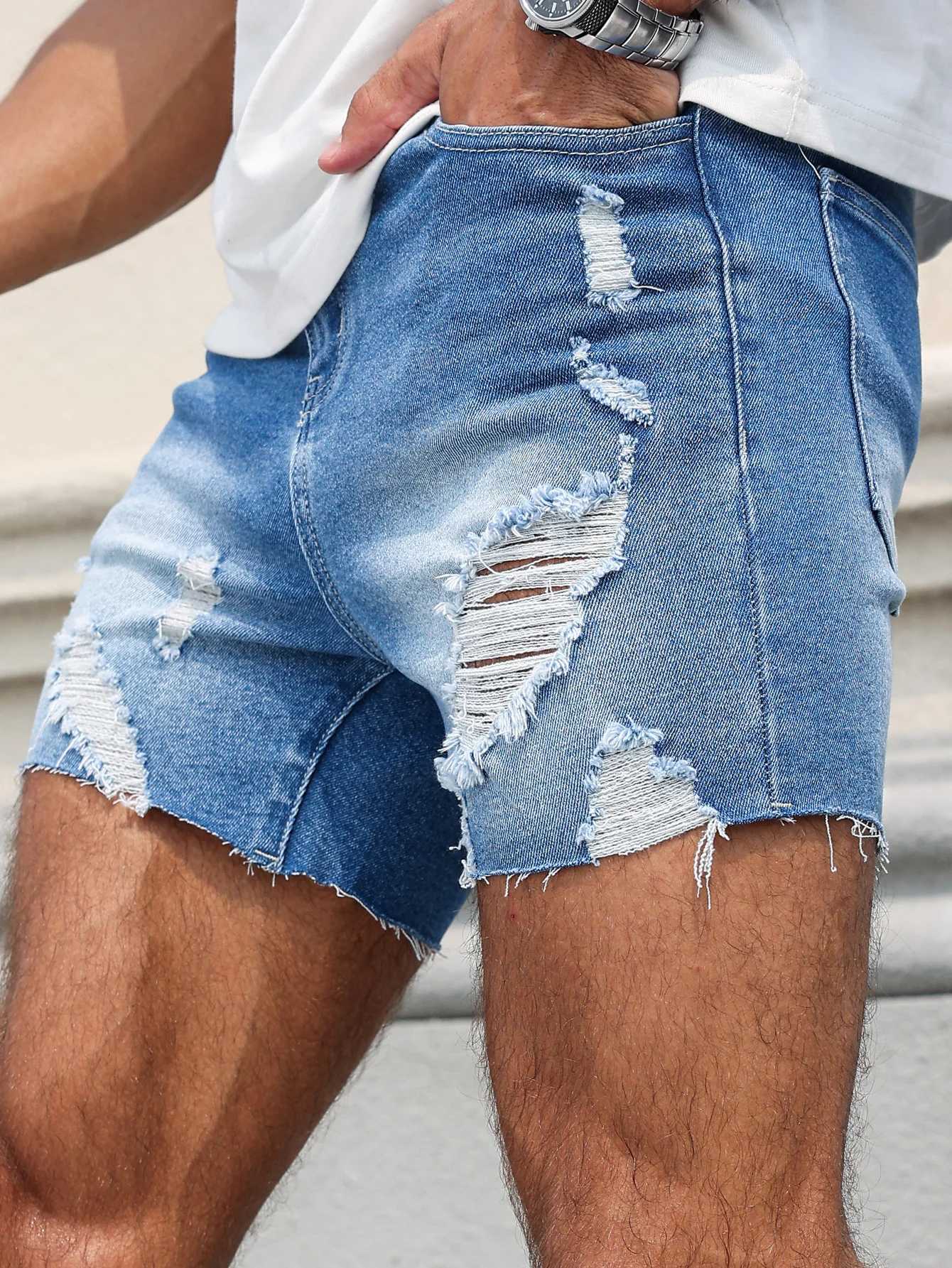 Mens Blue Denim Shorts.The ripped and worn style is popular. T250603