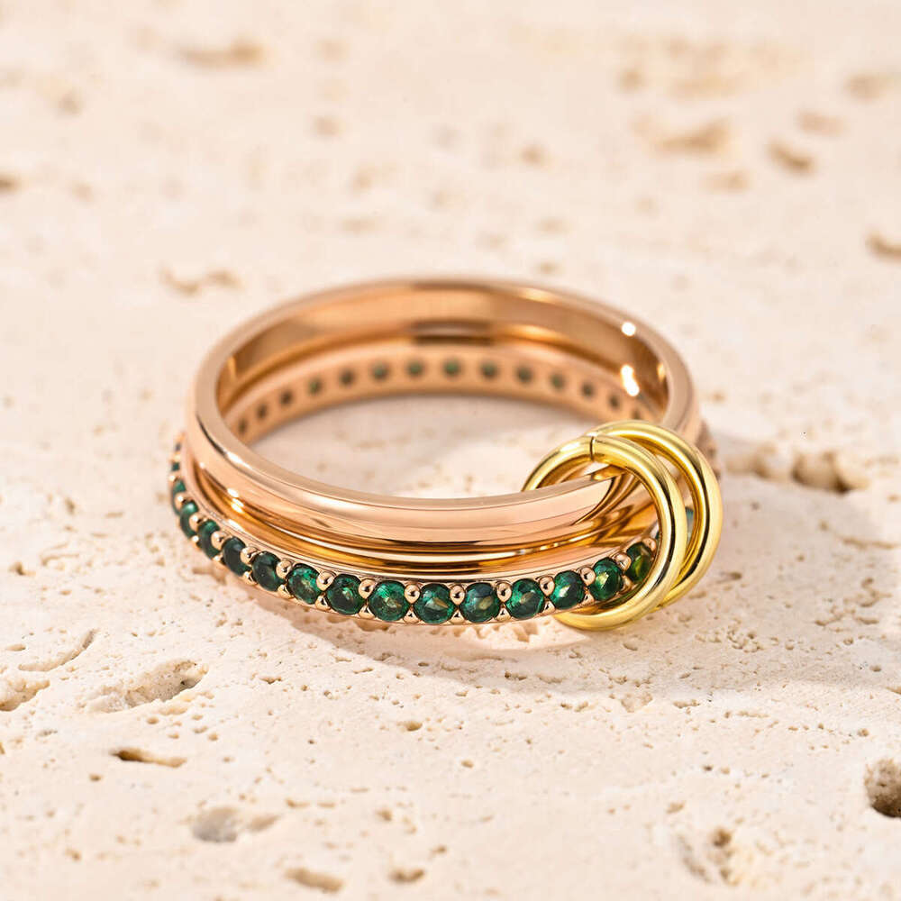 goldplated copper interlocking stacking rings inlaid with green cubic zirconia jewelry