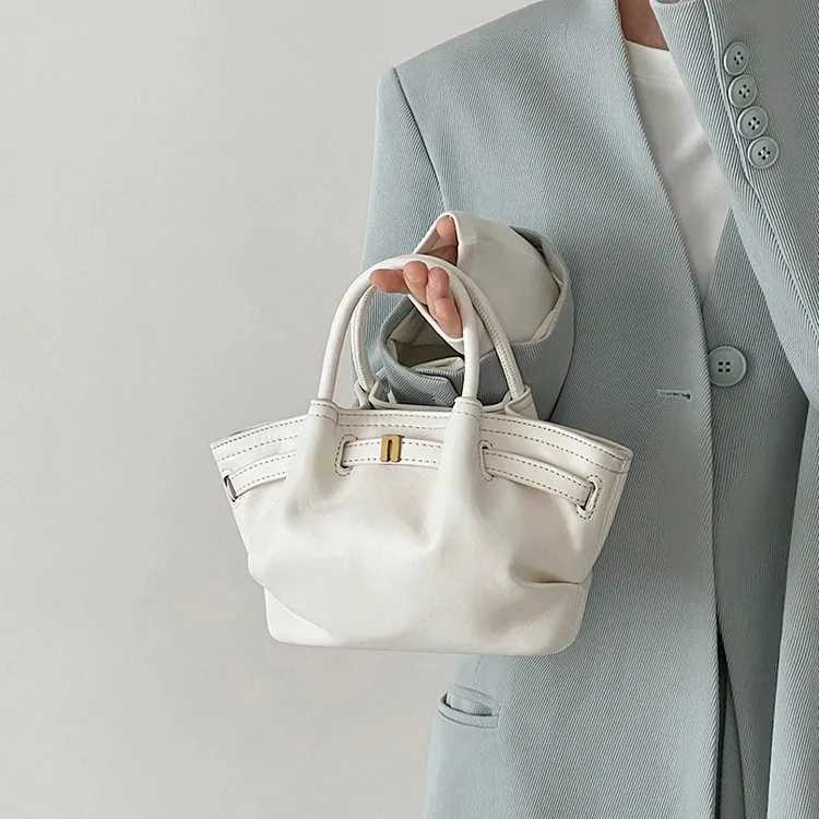 2025 Spring New Oil Wax Leather Casual Dumpling Bag Womens Fresh Pleated Commuters All-Matching Portable Messenger Bag W250602