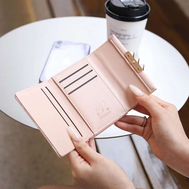 Autumn winter new women's short wallet Korean PU high texture iron frame printed small square bag simple and versatile stude