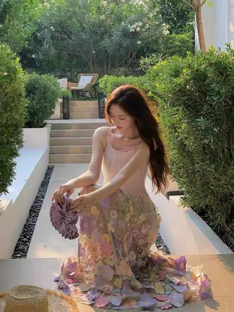 A three-dimensional floral French halter dress with a Monet Garden vacation style and a beach vacation vibe