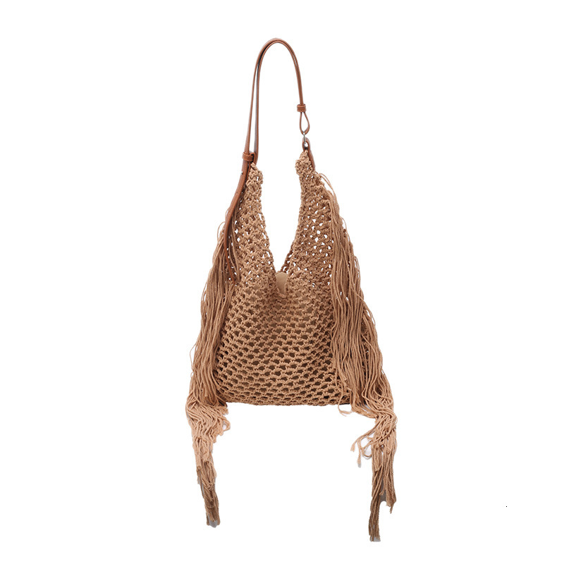 designer Hollow Handwoven Beach Bag for Women 2025 New Commuter Versatile Retro Tassel Vacation Style Single Shoulder Bucket Bag