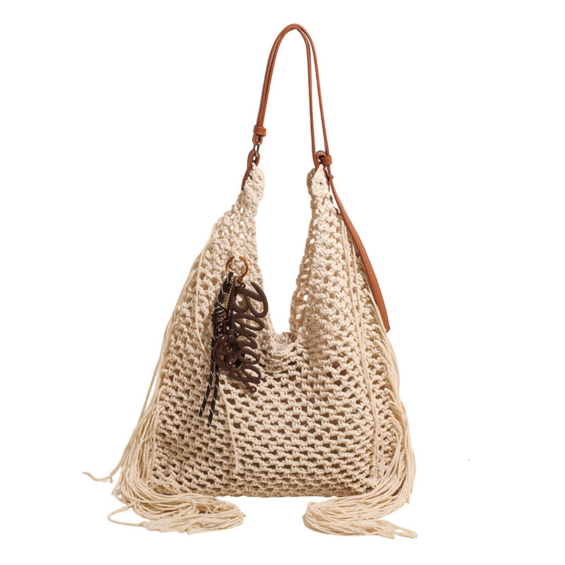 designer Vintage Tassel Bag for Women Hollow Woven Beach Bag 2025 New Commuter Ladies Shoulder Versatile Tote Bag