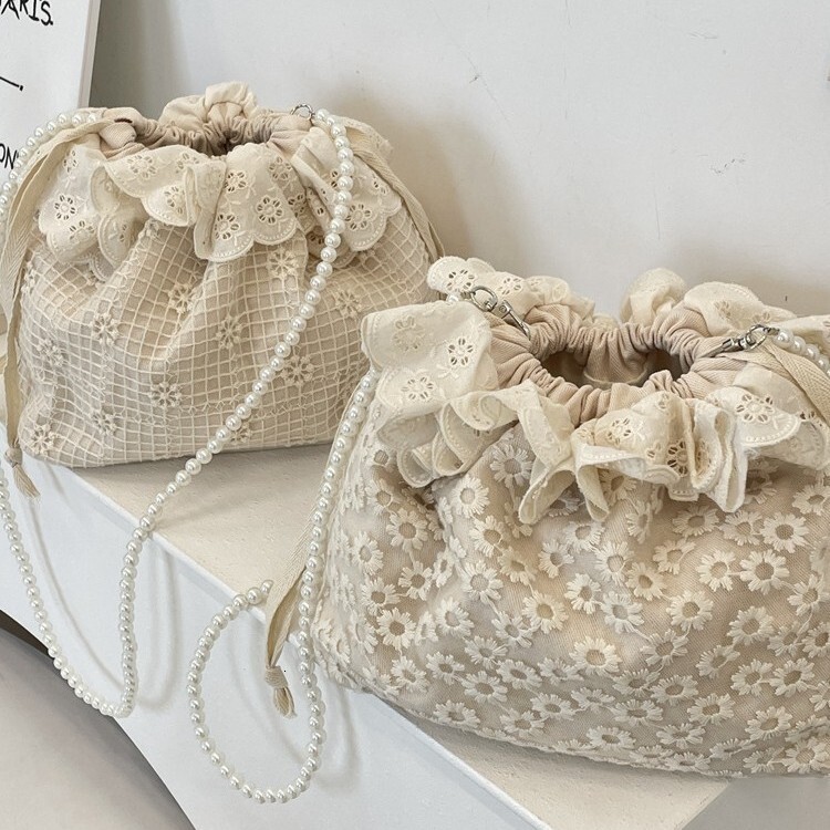Free Shipping 2025S designer new trendy and fashionable armpit lace versatile drawstring bucket shoulder crossbody pearl strip women small bag