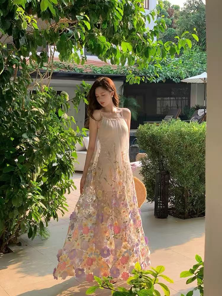 A three-dimensional floral French halter dress with a Monet Garden vacation style and a beach vacation vibe