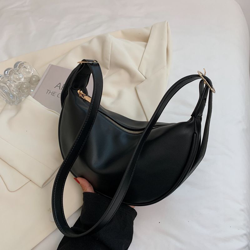New women's four season bag with simple and multifunctional design, niche office commuting shoulder width dumpling bag designer shoulder bag