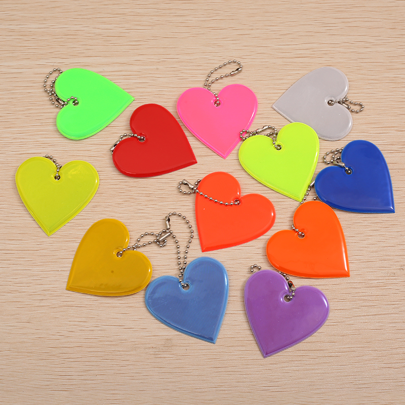 Creative Reflective Pendant for Backpacks - Safe Travel at Night with Multicolor PVC Glow-In-The-Dark Design