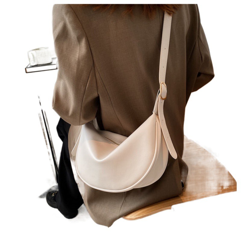 New women's four season bag with simple and multifunctional design, niche office commuting shoulder width dumpling bag designer shoulder bag