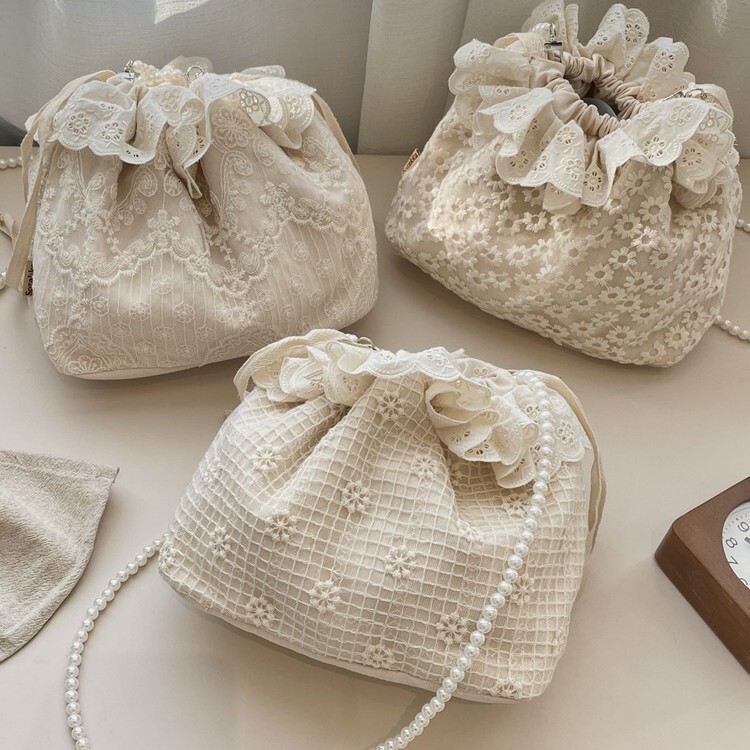 Free Shipping 2025S designer new trendy and fashionable armpit lace versatile drawstring bucket shoulder crossbody pearl strip women small bag