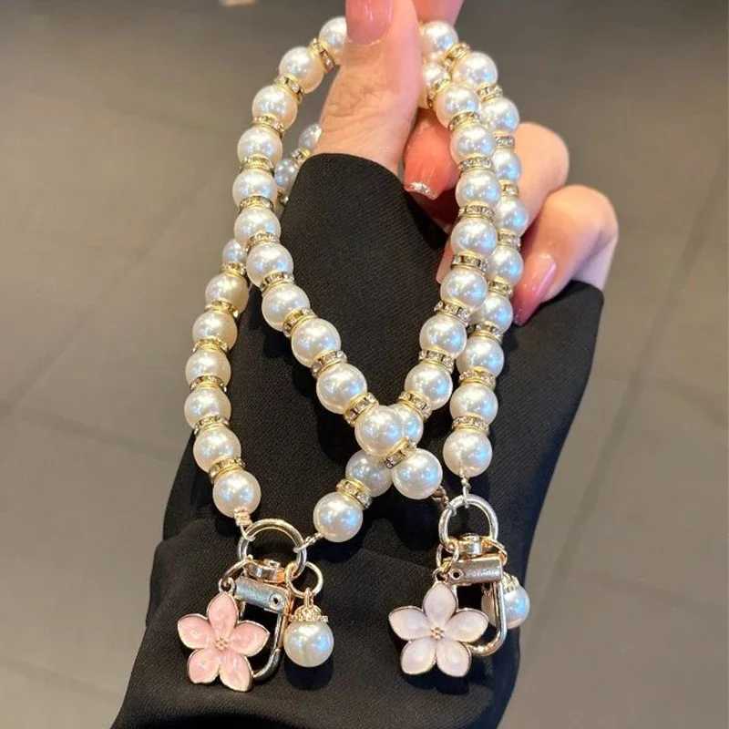 2024 Pearl Keychain Luxury Women Jewelry Shiny Pearl Bead Shell Phone Bag Backpack Charm Accessory Car Key Chain Pendant W250604