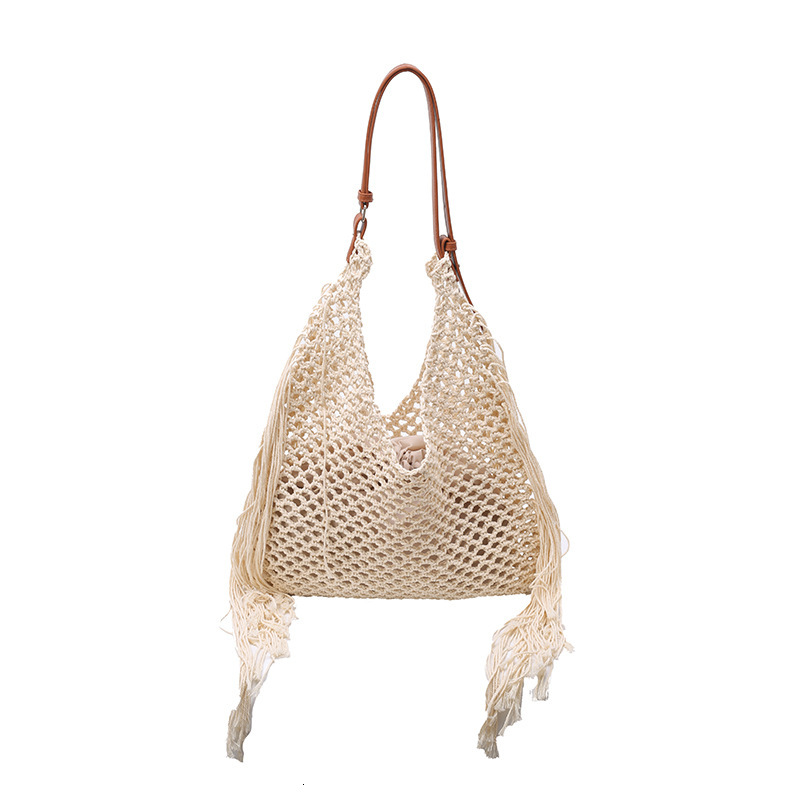 designer Hollow Handwoven Beach Bag for Women 2025 New Commuter Versatile Retro Tassel Vacation Style Single Shoulder Bucket Bag